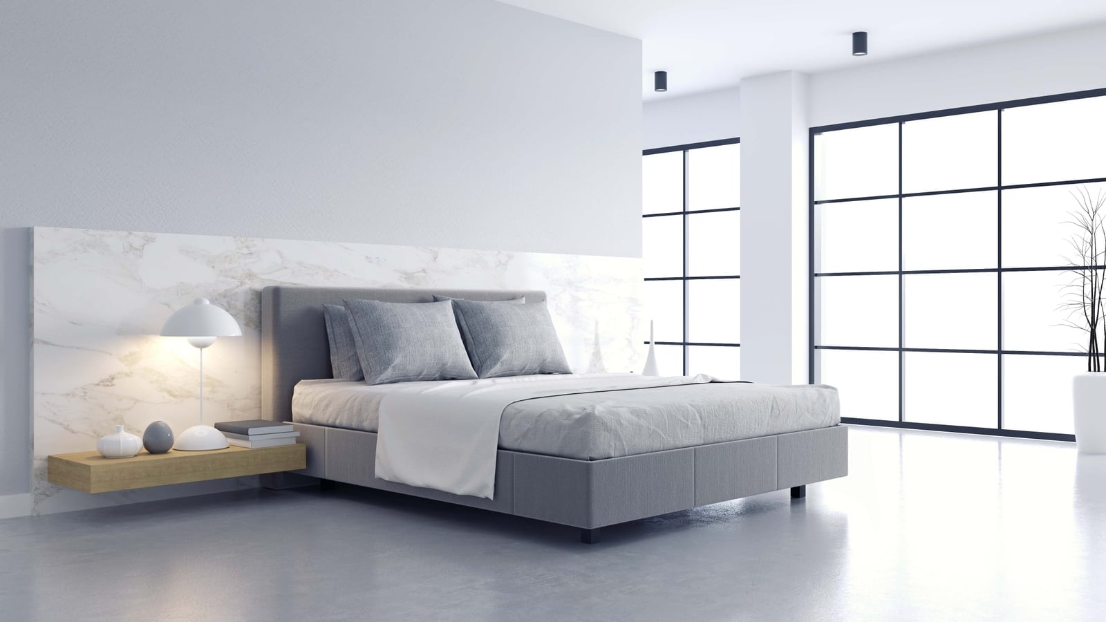 Modern bedroom with grey upholstered bed