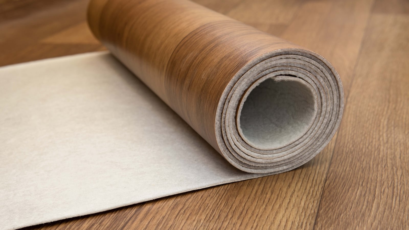 Rolled vinyl flooring on wood floor